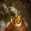 Amanda Jayne Wild Orchard Reed Diffuser, 170ml on the table