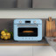 Smeg Retro Countertop Steam Oven - Pastel Blue on the kitchen counter