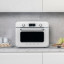 Smeg Retro Countertop Steam Oven - Ice White on the kitchen counter