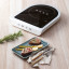 Smeg Portable Induction Plate with Probe - Matte White with a plate of food