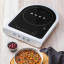 Smeg Portable Induction Plate with Probe - Matte White with a bowl of food