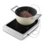 Smeg Portable Induction Plate with Probe - Matte White measuring the temperature of the meat