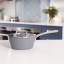 Laura Ashley Non-Stick Saucepan with Glass Lid, 16cm - Dark Slate on the countertop