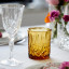 Lyngby Sorrento Whisky Glasses, Set of 4 - Amber on the table