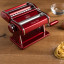 Marcato Atlas 150 Manual Pasta Machine with Pasta Wheelon the table with pasta
