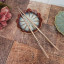 Nicolson Russell Stainless Steel Chopsticks, Set of 2 - Rose Gold on the table