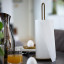 Zone Denmark Singles Kitchen Roll Holder - Black with a kitchen towel
