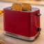 Bosch MyMoment 2-Slice Compact Toaster, 950W - Red with two slices of bread