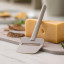 Rosti Emma Cheese Slicer - Humus with a slice of cheese