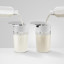 Jura Milk Carafe, 500ml with milk on the table
