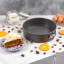 Laura Ashley Non-Stick Carbon Steel Springform Cake Pan, 23.5cm on the kitchen counter