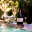 Le Lude Cap Classique Brut Rosï¿½ Rï¿½serve MCC In Gift Box, 2021 on a tray with a glass of brut rose