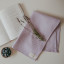 Me Thyme Cotton Tea Towel - Pale Purple on the table