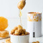 Snackadamia Gourmet Roasted Honey Flavoured Macadamia Nuts - 100g on the table