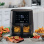 Kenwood Digital Airfryer with Grill Function and Clearcook Window, 9L with food on the table