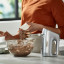 Kenwood HandMix Lite Hand Mixer, 450W on the table with chocolate cream