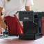 Gaggia Evolution Espresso Coffee Machine - Black on the kitchen counter with a Portafilter