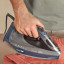 Braun TexStyle 9 Steam Iron with iCare, 3200W ironing a shirt
