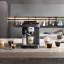 DeLonghi Magnifica Evo Next Bean to Cup Coffee Machine on the kitchen counter with coffee cups