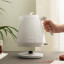 DeLonghi Ballerina Cordless Kettle, 1.7L - Marble White on the table