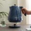 DeLonghi Ballerina Cordless Kettle, 1.7L - Sapphire on the table