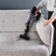 Rowenta 7.60 Cordless Stick Cleaner X-Pert Force Vacuum Cleaner on the sofa