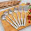 Laura Ashley Stainless Steel Slotted Spoon with Ceramic Handle - Sage Parterre with other utensils