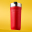 Le Creuset On The Go Vacuum-Insulated Stainless Steel Travel Mug, 350ml - Cerise on the table