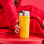 Le Creuset On The Go Vacuum-Insulated Stainless Steel Travel Mug, 350ml - Nectar on the table