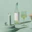 Vacu Vin Wine Saver Loop - Jade with a wine bottle