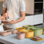 Guzzini Eco Store & More Shallow Container, 1.9L - Avocado green on the kitchen counter 