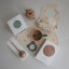 Mushie Silicone Placemat - Dinosaurs on the table