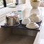 Joseph Joseph Platform Foldable Over-Sink Drainer with dishes