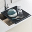 Joseph Joseph Platform Foldable Over-Sink Drainer with dishes