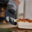 Joseph Joseph Pinch Oven Gloves, Set of 2 holding a casserole 