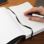 The Papery Classic Multi-Planner - Black on the table