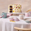 Le Creuset Jardin Relief Stoneware Mug, 350ml - Sea Salt angle on the table