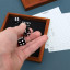 Suck UK Iron & Glory Wooden Yatzy Dice Game on the table