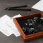 Suck UK Iron & Glory Wooden Yatzy Dice Game on the table