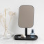 Brabantia ReNew Mirror with Storage Tray - Dark Grey with a bottle of perfume