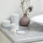 Brabantia ReNew Storage Pots, Set of 3 - White next to the basin