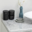 Brabantia ReNew Storage Pots, Set of 3 - Dark Grey next to the basin