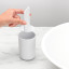 Brabantia ReNew Toothbrush Holder - White next to a basin