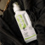 GoodBasics Probiotic Laundry Liquid, 1L in a laundry basket with clothes