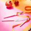Olivia Princess Stainless Steel Cutlery Set, 16-Piece - Pink on the table