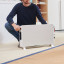 DeLonghi Slim Style Convector Heater with Fan, 2000W handheld showing scale