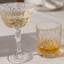 Lyngby Melodia Crystal Champagne Coupe Glasses, Set of 4 with champagne on the table