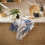 Ulster Weavers Willow Toile Cotton Tea Towel on the kitchen counter