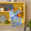 Ulster Weavers Summer Fruits Clementine Cotton Tea Towel on a shelf