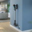 Philips 3000 Series Cordless Stick Vacuum hung on the wall 
